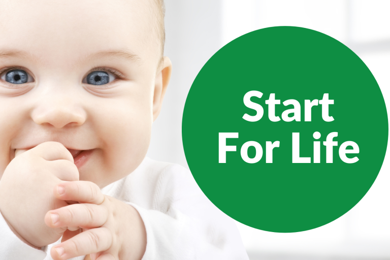 Baby sucking thumb smiling with start for life title