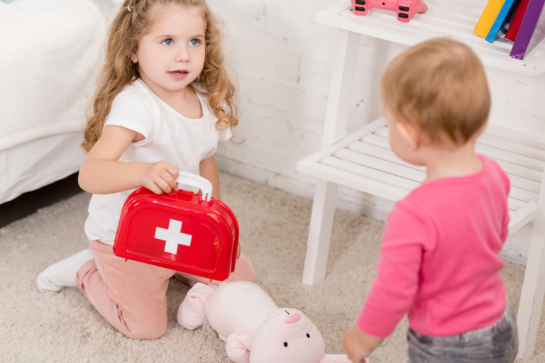 Children playing with first aid box