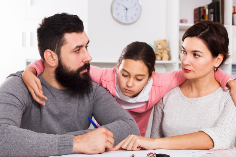 Unhappy parents with young girl