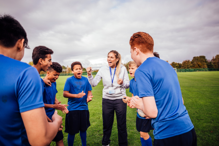 Coach talking to sports team