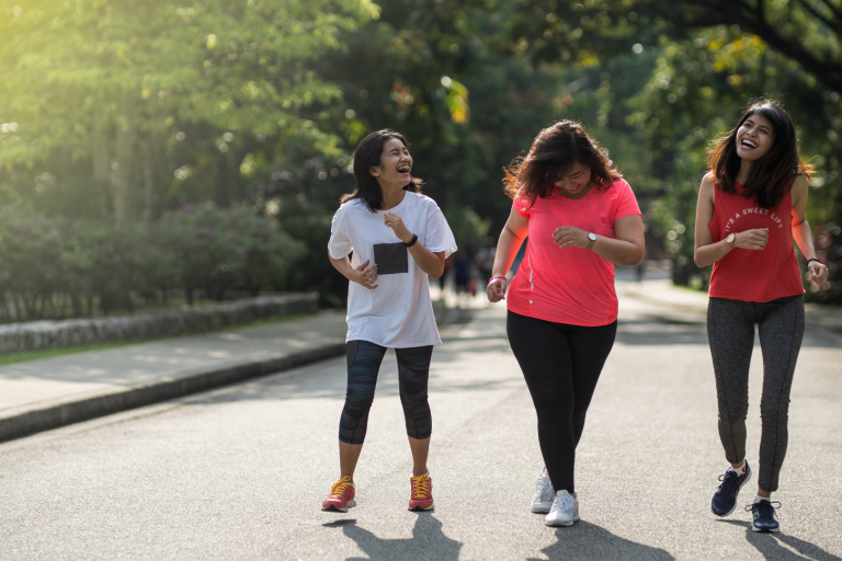 Teenage girls working along road