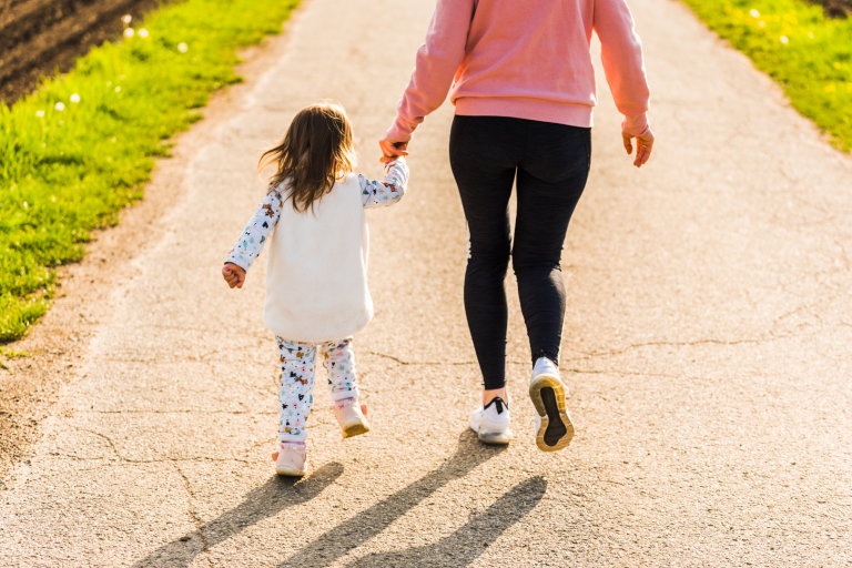 Toddler and mum walking