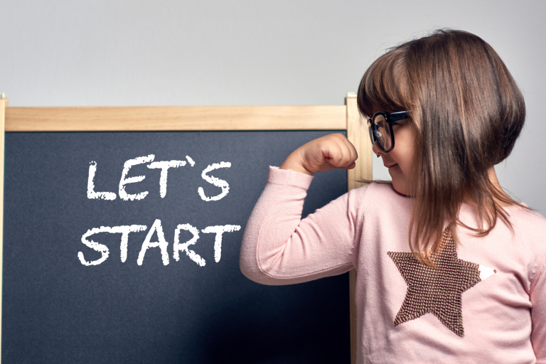 girl in front of chalk board saying let's start