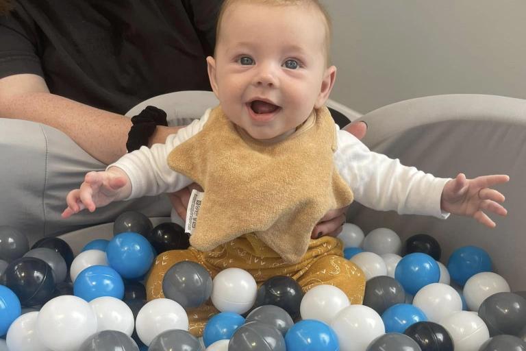 Child playing in a pitball