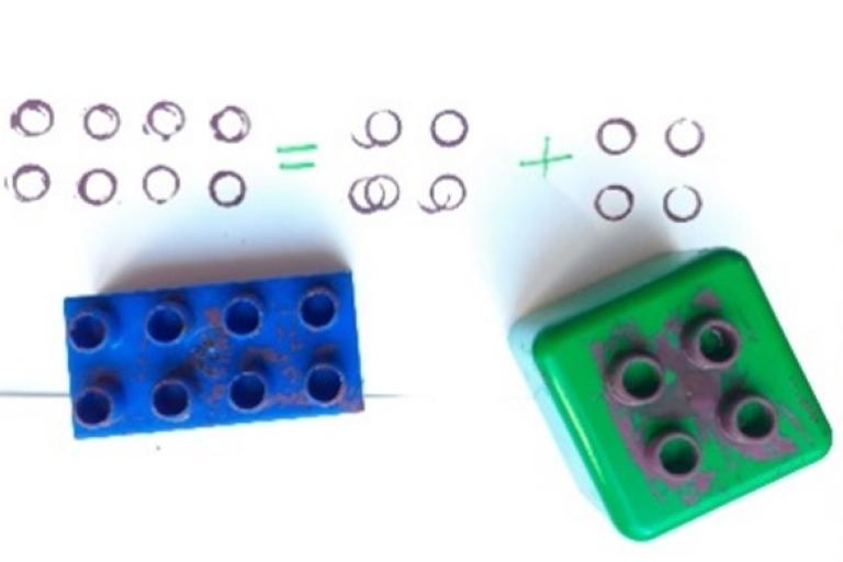 Lego used as stamps to show addition