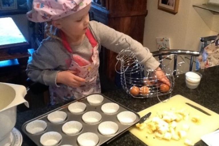Child helping to bake in the kitchen