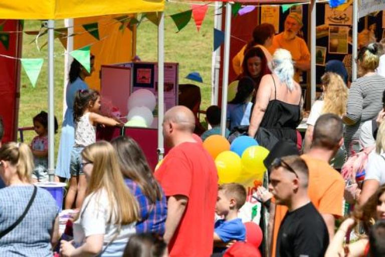 Families standing at stalls