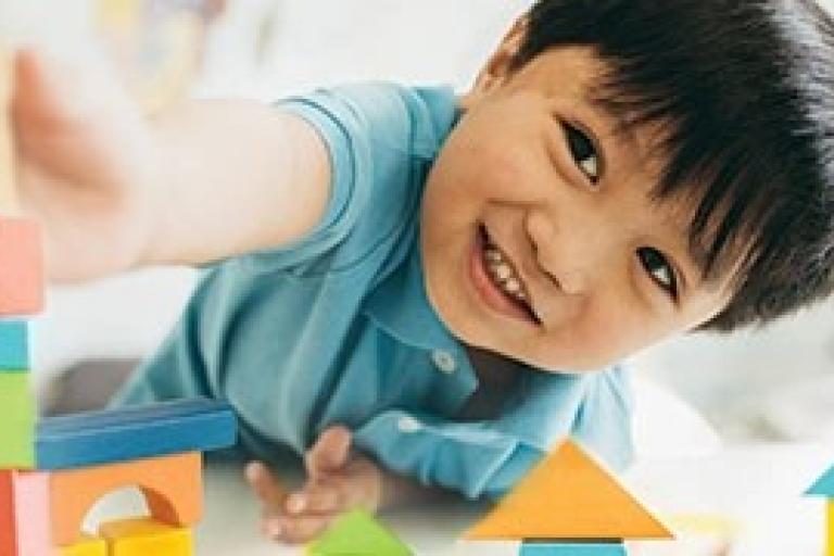 Child playing with building blocks