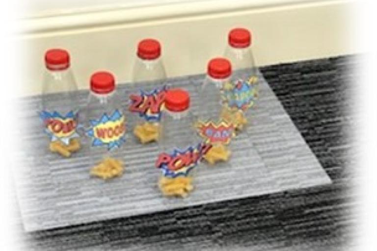 Plastic bottles placed like bowling pins
