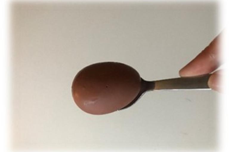 Egg being balanced on a spoon
