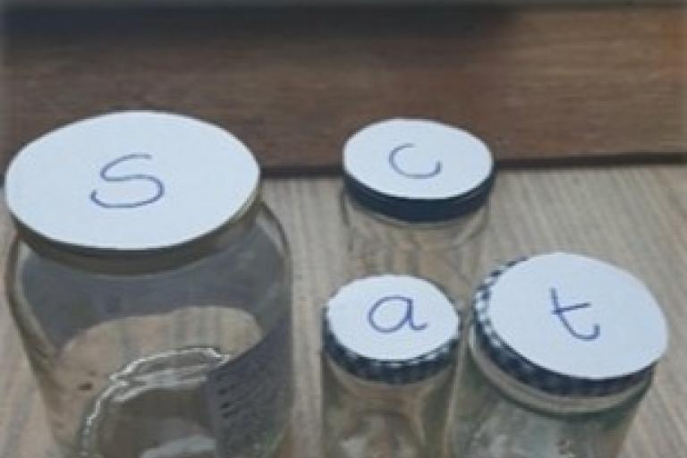 Jars with random items inside beginning with the same letter