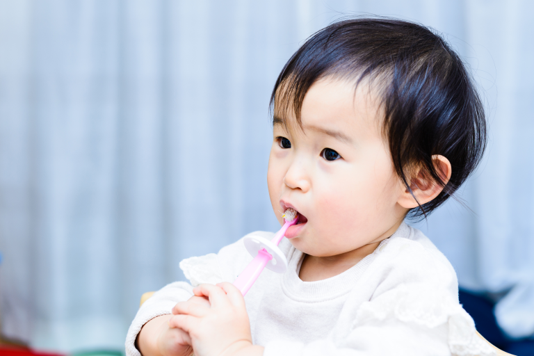 Child using a toothbrush