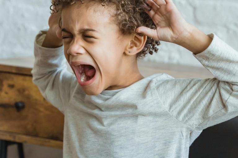 Young boy screaming