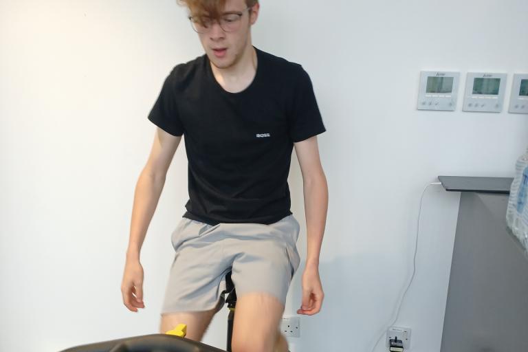 Young person on a stationary bike