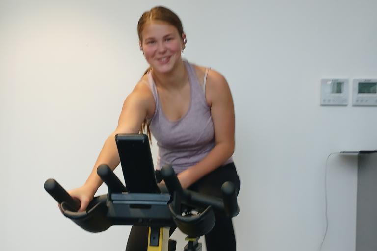 Young person on a stationary bike