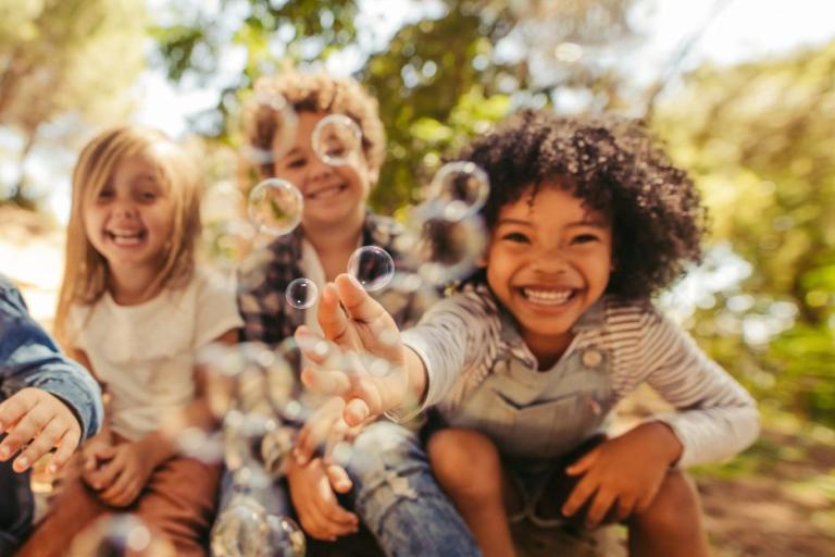 Children playing with bubbles