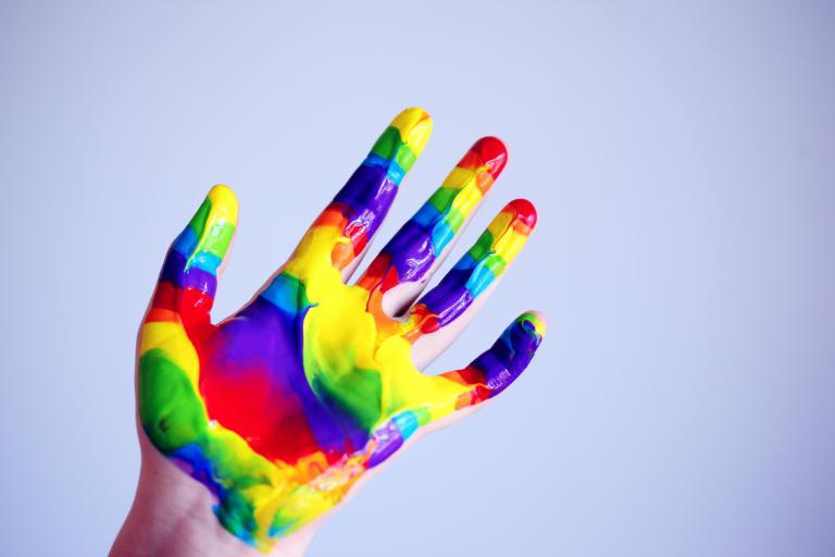 Childs hand in paint