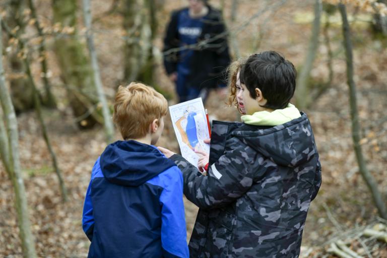 Children following a map