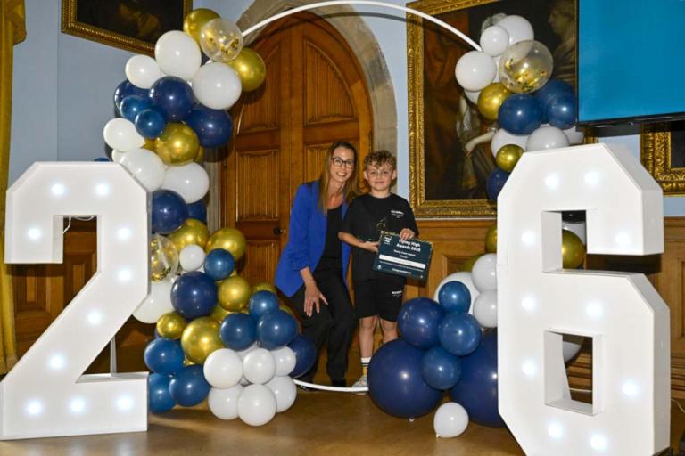 George receiving his award