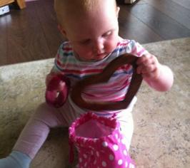 Baby taking toy shapes out of a bag