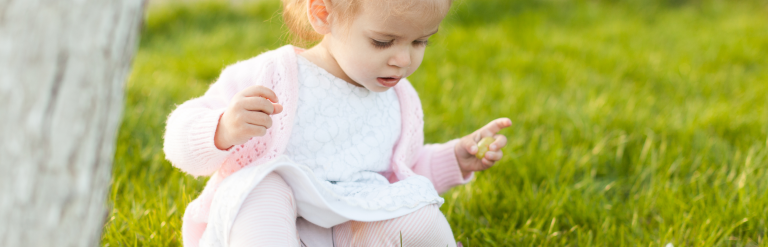 Child sat on grass