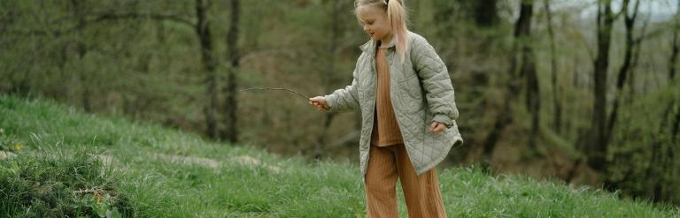 Child looking for sticks