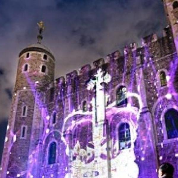 Light district graphic projected on side of castle