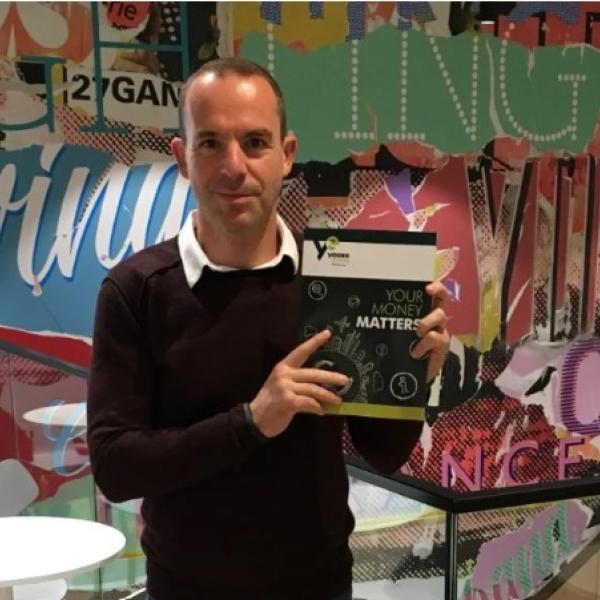 Martin Lewis holding money matters textbook