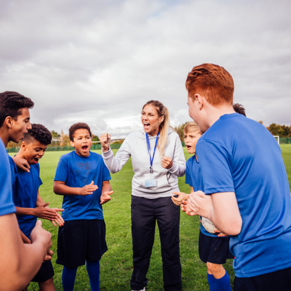 Coach talking to sports team